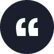 White quotation mark symbol centered on a dark blue circular background.
